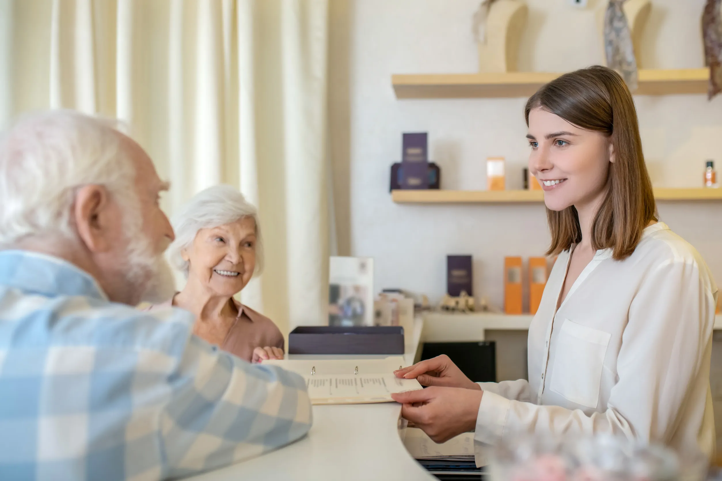 Elderly couple discussing procedures with a specialist in a spa center